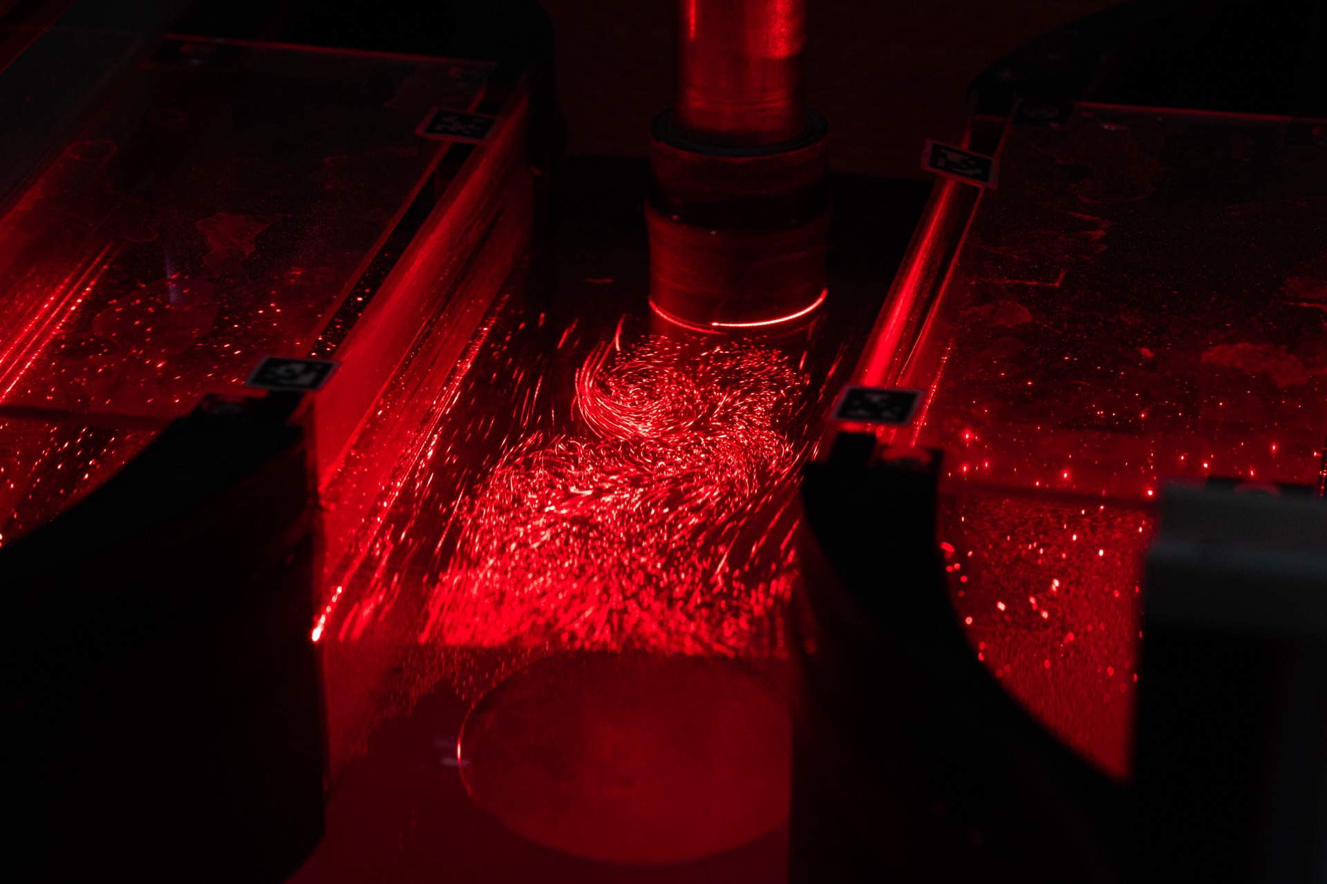 Close-up of V0 test section with red laser and seeding particles