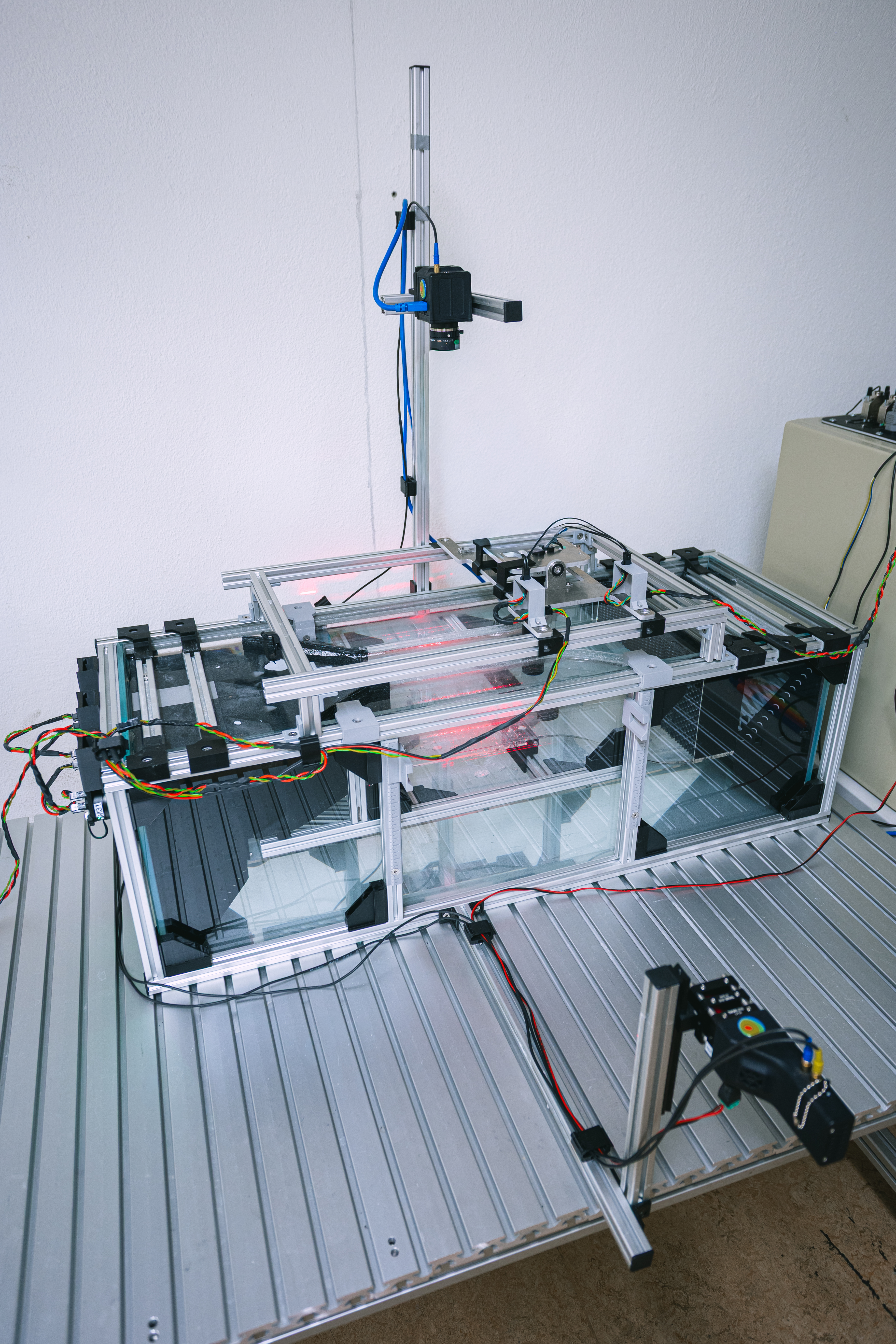 V1 complete laser-PIV setup in ambient light with the camera mounted above the test section